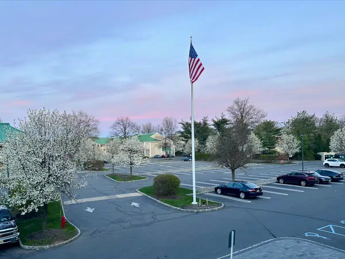 View of Bridgepointe Dental Studio from the parking lot with the Metuchen skyline in the background.